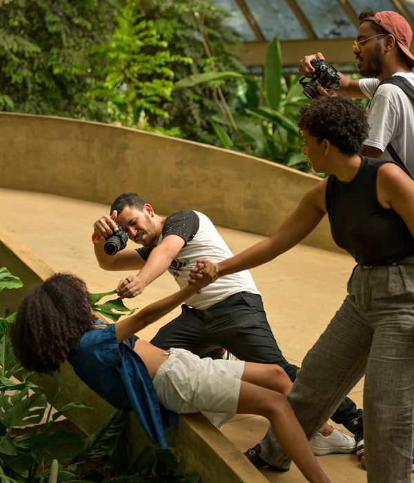 Diverse group of people smiling during a light exercise session.